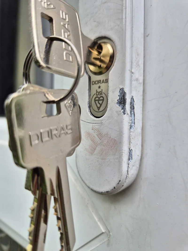 Door cylinder and keys photographed after a lock change for lost keys in Leeds LS6